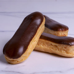 Small Eclair with Cream Dipped in Chocolate - Coctail Sweets - WILTON PATISSERIE